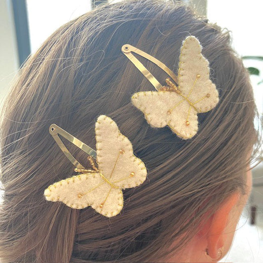 Luna - Leena haarspeldjes vlinder 2x - gebroken wit & goud - viltwol - handgemaakt in Nepal - Smart Simple